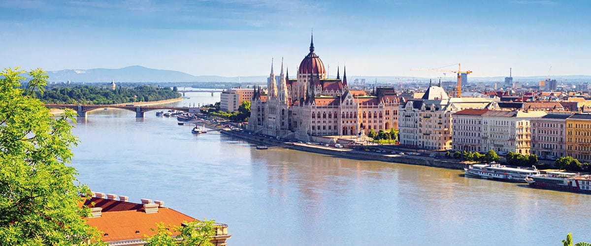 A view across the Danube River to the Budapest Parliament Building in Hungary